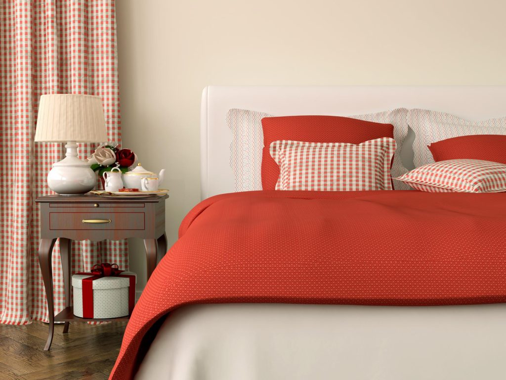 Bedroom with orange linens