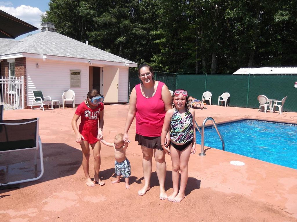 mother with children at pool