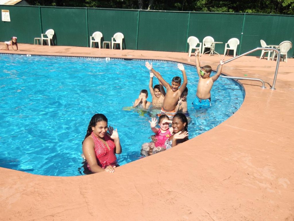 children playing in pool