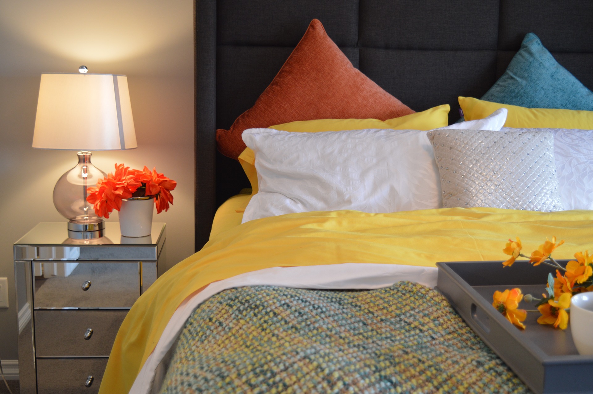 Colorful Bed with Yellows, orange and blue linens