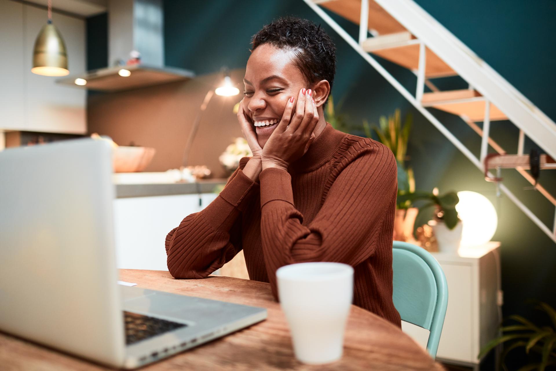 smiling woman using laptop