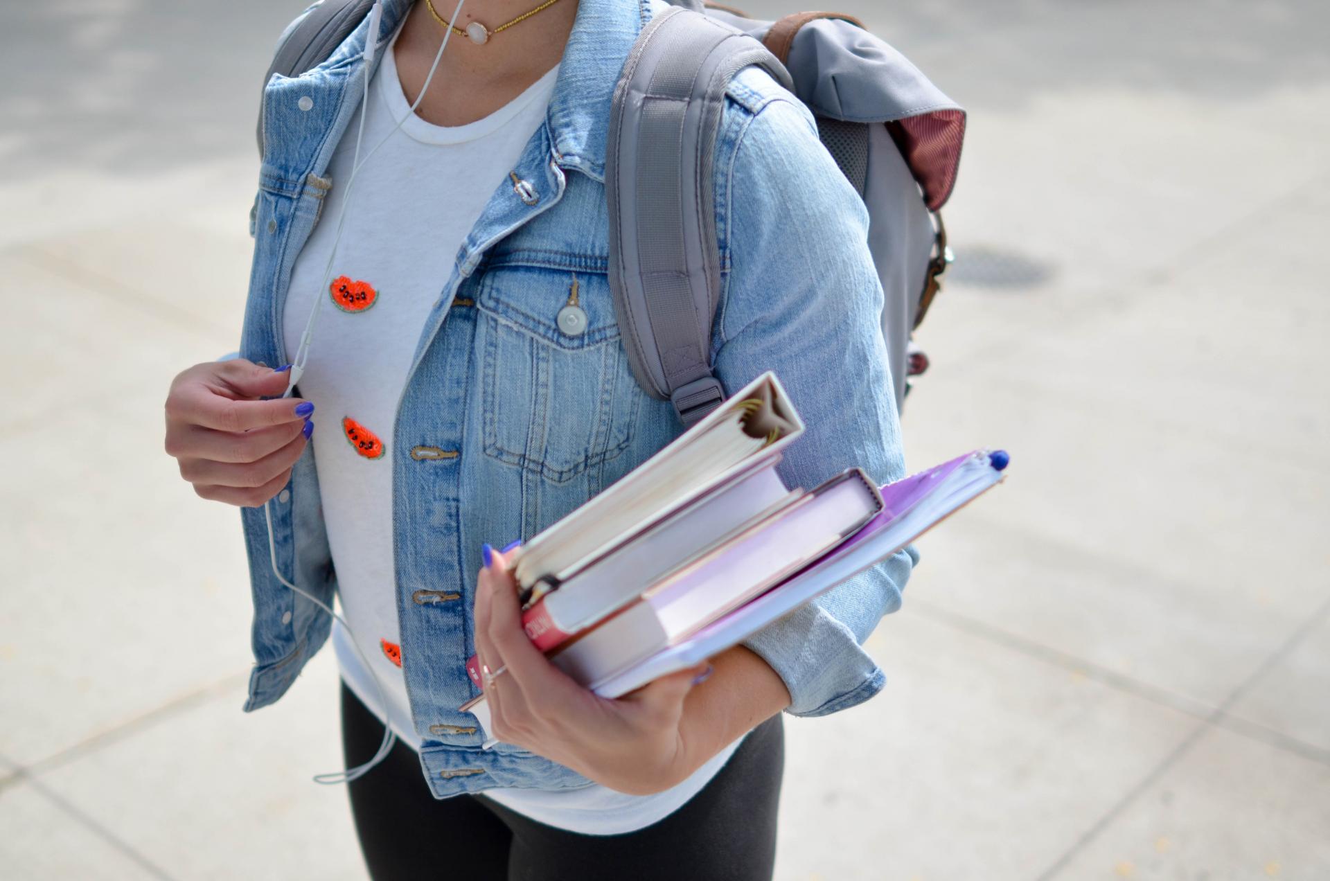 college student holding books